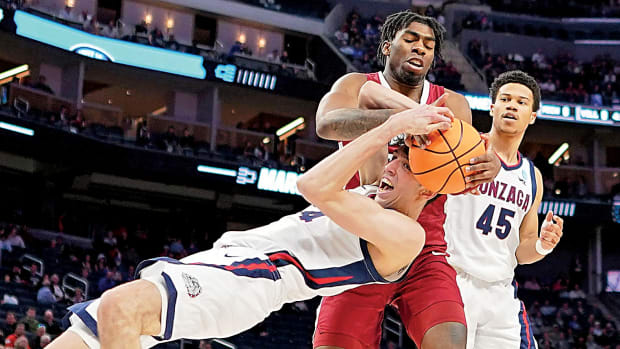 Gonzaga Bulldogs center Chet Holmgren (34) battles for the ball against Arkansas Razorbacks forward Kamani Johnson (20) during the first half in the semifinals of the West regional. The win sets up a rematch of the 1994 national championship game between Duke and Arkansas in the Elite 8 in what is Blue Devils' coach Mike Krzyzewski's final season.
